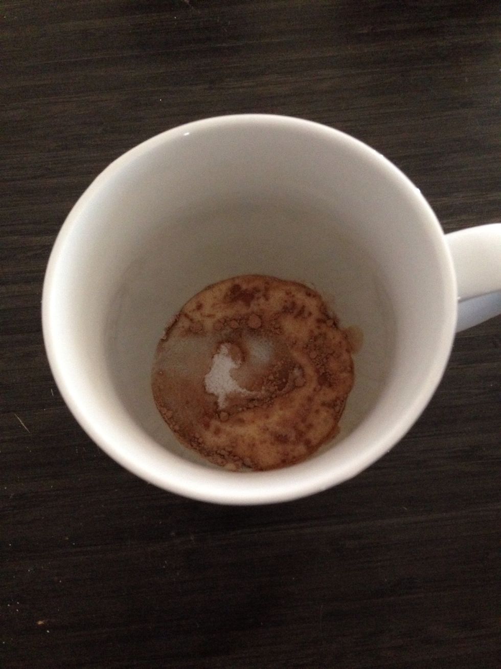 While the other mug is in the microwave get the other mug and put two tea spoons of drinking chocolate two teaspoons of sugar and one table spoon of milk and mix with the teaspoon