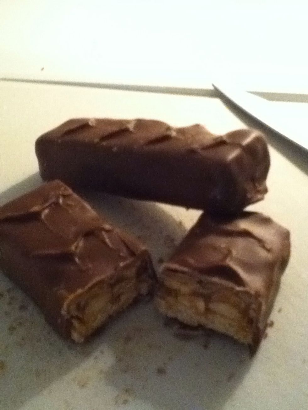 While the pancakes is baking chop 3 snickers into smaller pieces.