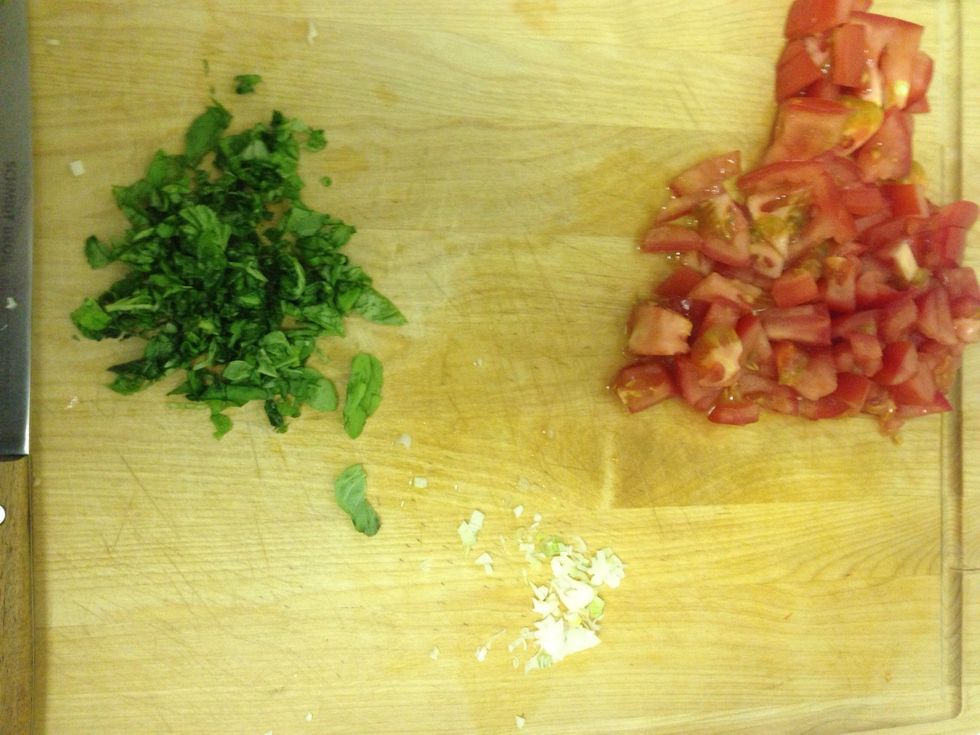 While the pasta is cooking, chop up your tomatoes (I used regular tomatoes. But I usually make it with cherry tomatoes) garlic, basil and green onions (the white part only)