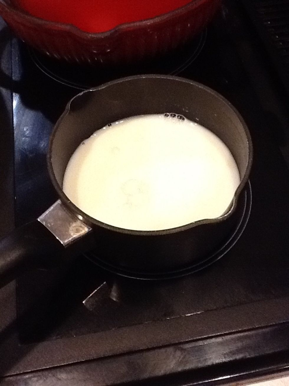 While the pasta is cooking, warm milk in a saucepan.