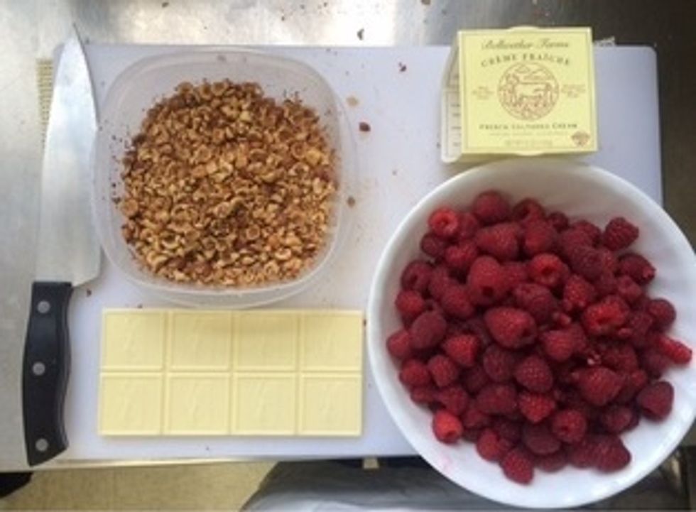 while the pasta water boils prepare the garnishes (raspberries, hazelnuts, creme fraiche, white chocolate)