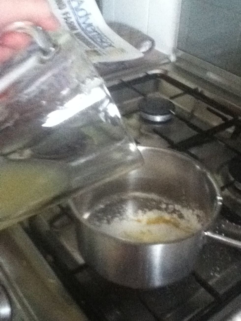 While the pastry is baking, prepare the filling. Mix half the conflour, 100g of sugar and lemon zest in a saucepan. Add the lemon juice, orange juice and 200ml of water