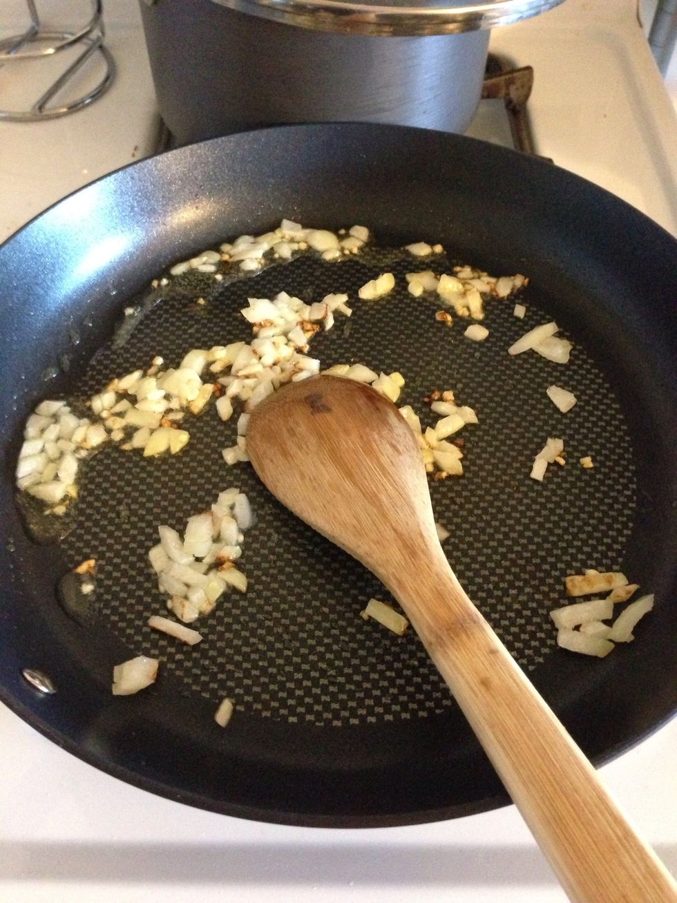 While the peppers and tomatillos boil, dice up 1/2 an onion and 1 garlic clove and saut\u00e9e in pan with about 2 tbs of oil. I use grape seed oil but you can use corn or vegetable too. Brown lightly.