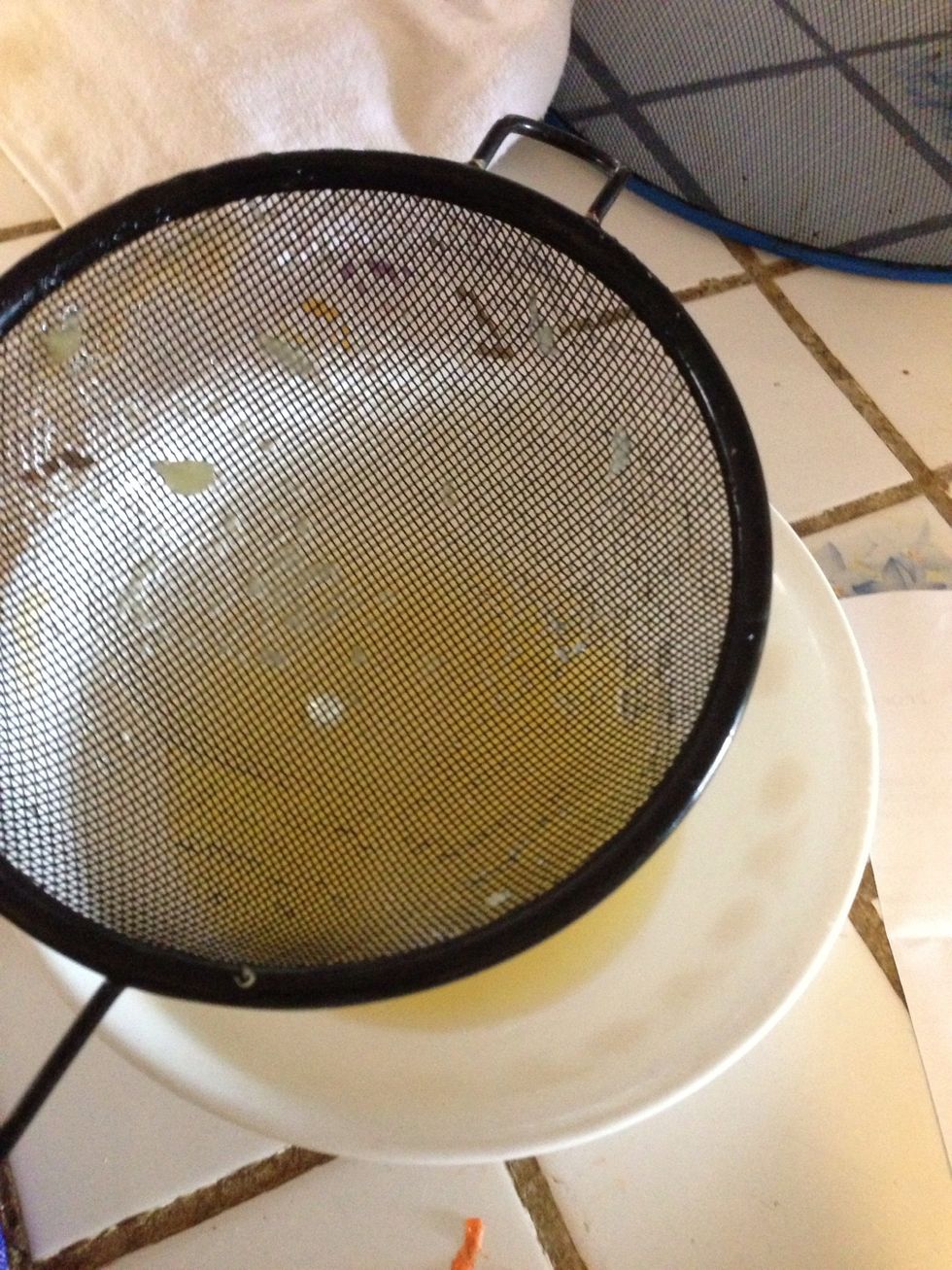 While the pork is simmering, take out one can of pineapple chunks and separate the juice and the fruit. Reserve the juice for later. What happened to the fruit you say??