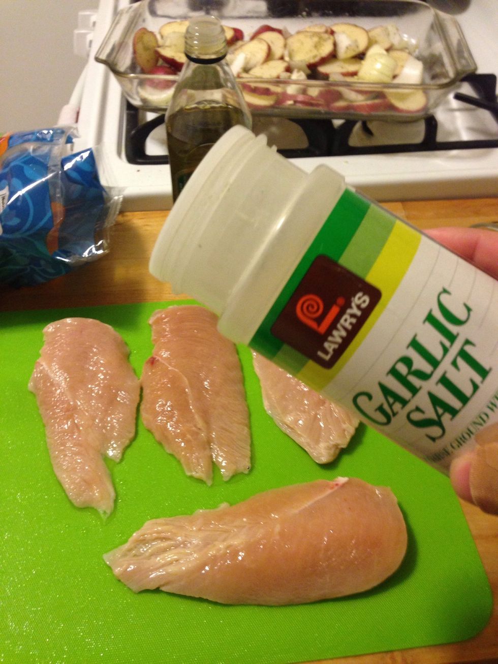 While the potatoes are cooking, slice the chicken breasts down the middle and lightly sprinkle garlic salt on the chicken halves. I used about 1/2-1 tsp for all 3.
