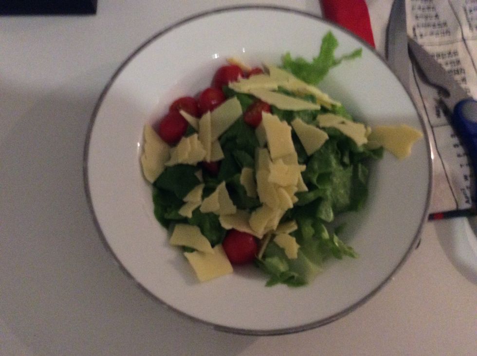 While the salmon is cooking make the salad. Add lettuce tomato cucumber cheese and a bit of dressing, you can use vinegar and salt. Just make sure you wash everything.