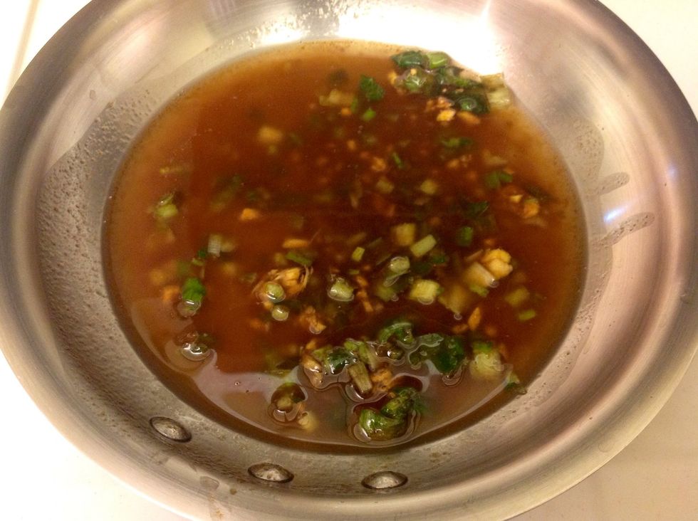 While the salmon rolls are frying, heat up your dipping sauce which consists of Tessemaes Soy Ginger, green onions and fresh ginger root. I also added a little bit of honey and additional soy sauce!