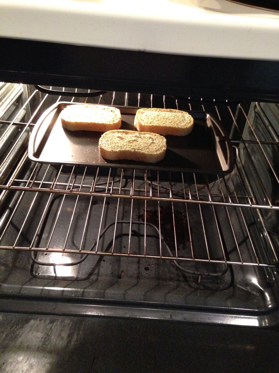 While the sauce simmers lets place bread in oven ( read box directions )