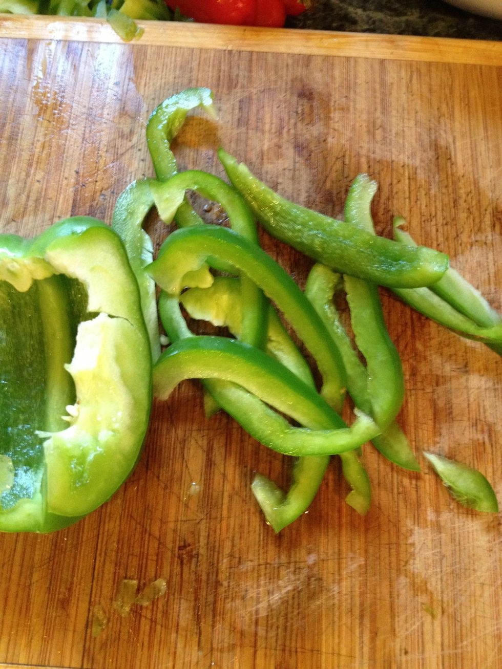 While the sausages are browning we will start to slice the peppers.