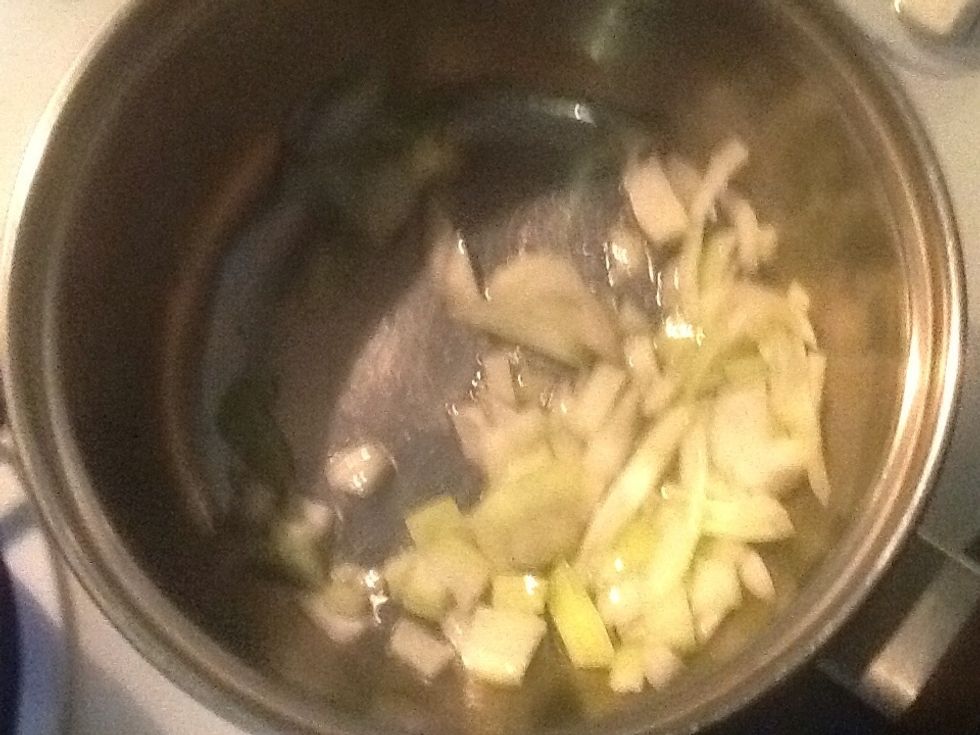 While the spaghetti is boiling add the oil and onion to a medium sized saucepan and cook until onion is soft.