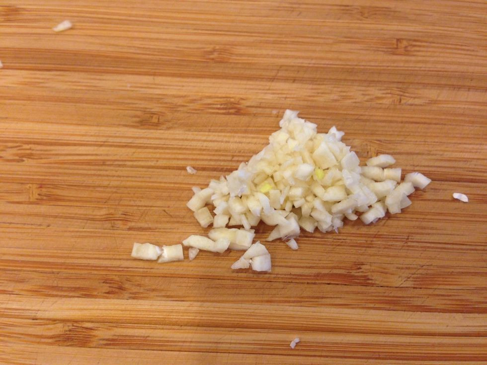 While the sprouts are cooking, dice 1 clove of garlic.