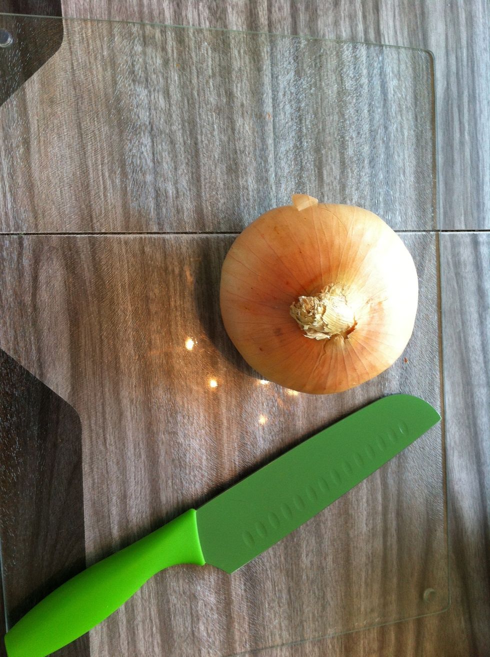 While the tomatoes are cooking, slice up the onion into small pieces