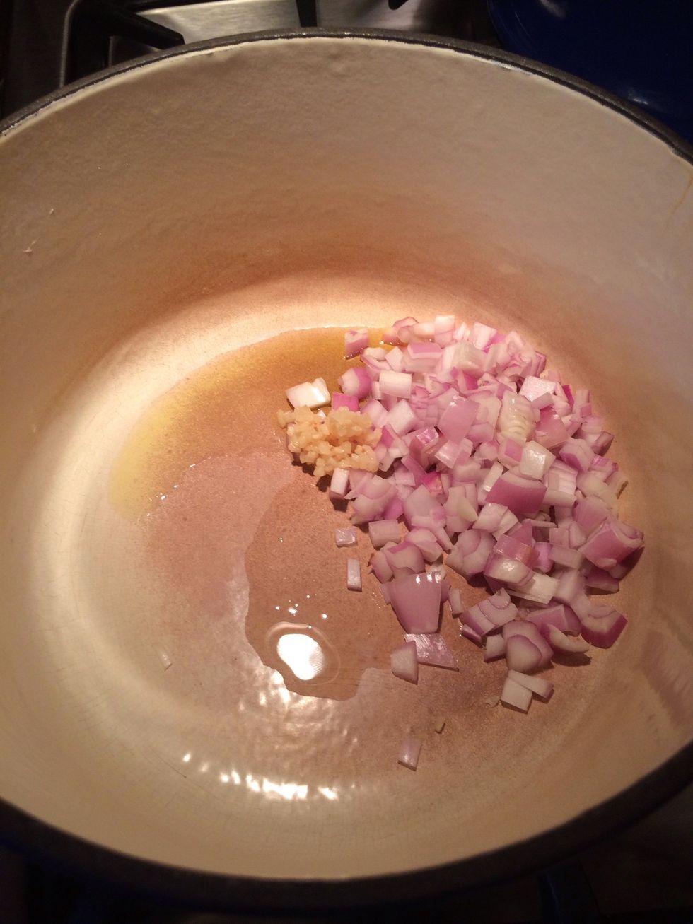 While the tomatoes are roasting.... Add 2 tbls of olive oil to stock pot, diced shallot and chopped garlic. Let this sit. We will saut\u00e9 this later. Time to fire the peppers.