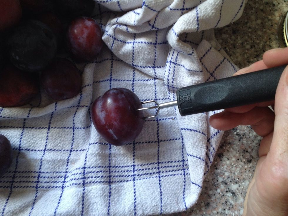 While the vinegar/water/sugar is boiling, prick holes in your plums all over using a small fork or a needle.