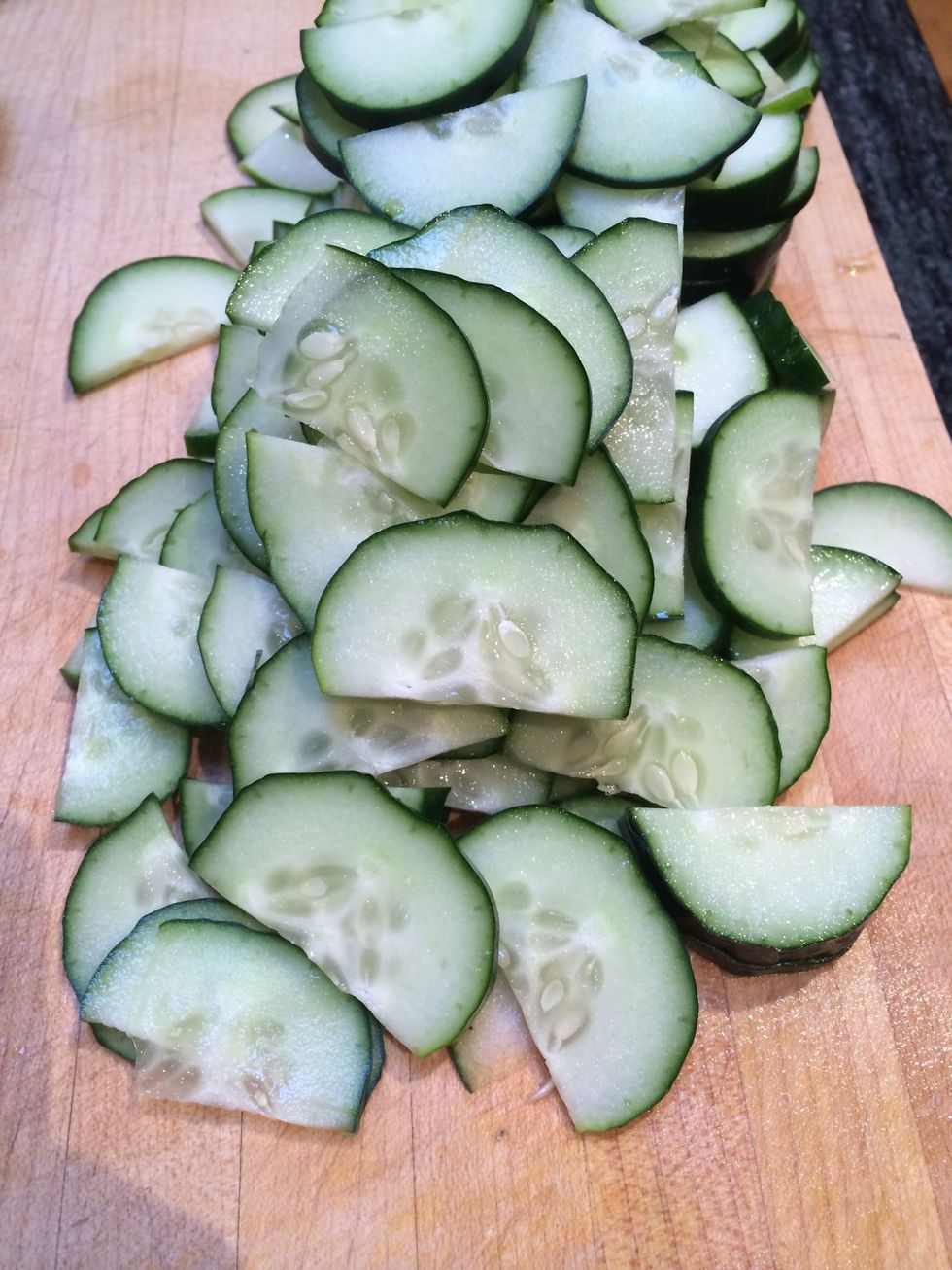 While the wakame is softening, thinly slice the cucumber.