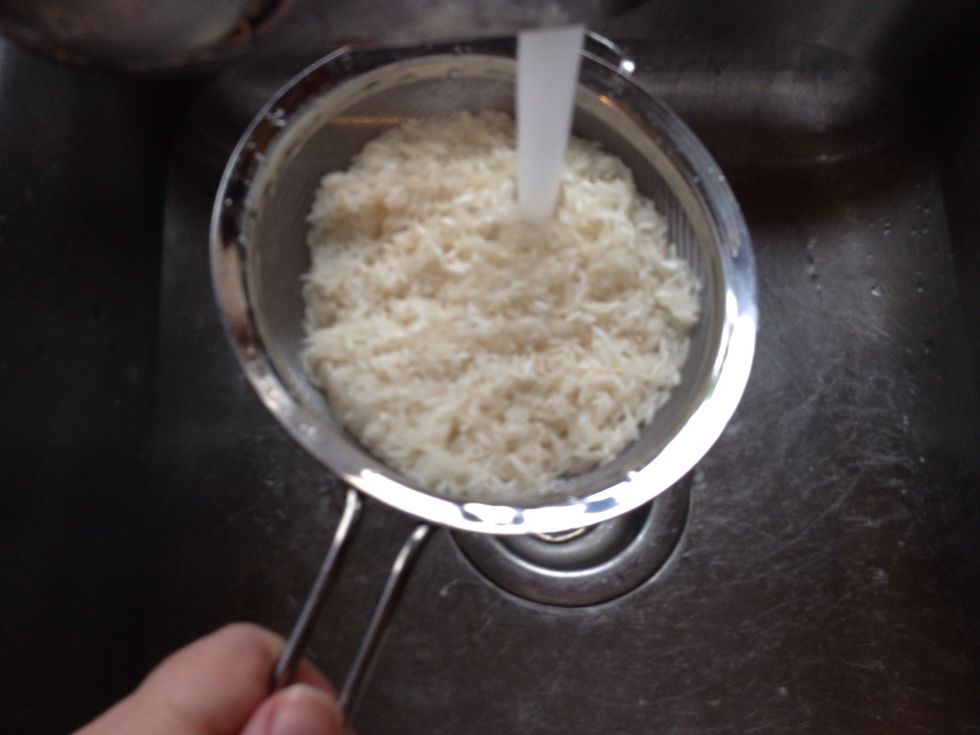 While the water is coming to a boil rinse your rice thoroughly. This removes a lot of extra starch that causes rice to become really sticky.