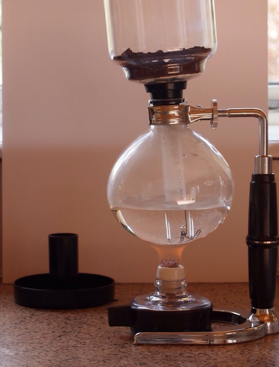 While the water is heating up attach the upper part of the pot making sure it is a snug fit.