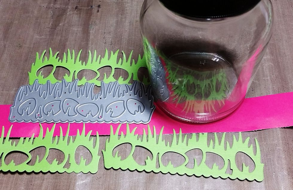 While the wood parts were drying I cut 3 spring grass sections in Lime cardstock and a 1x12 inch strip of Hot pink cardstock. I ink the edges of all the papers in light brown.