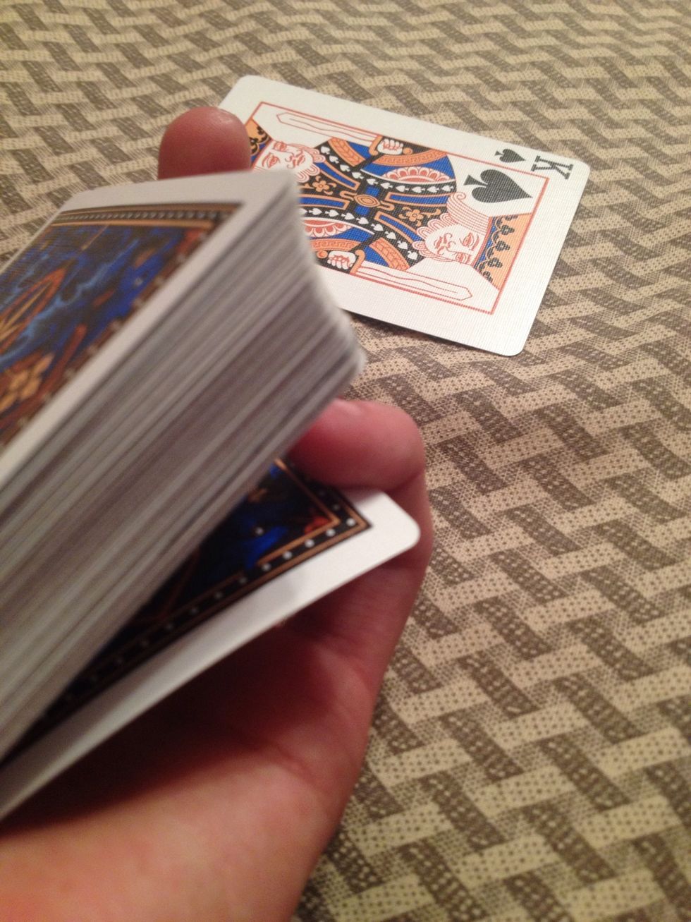 While they look at their card get a pinky break on top of the bottom card.