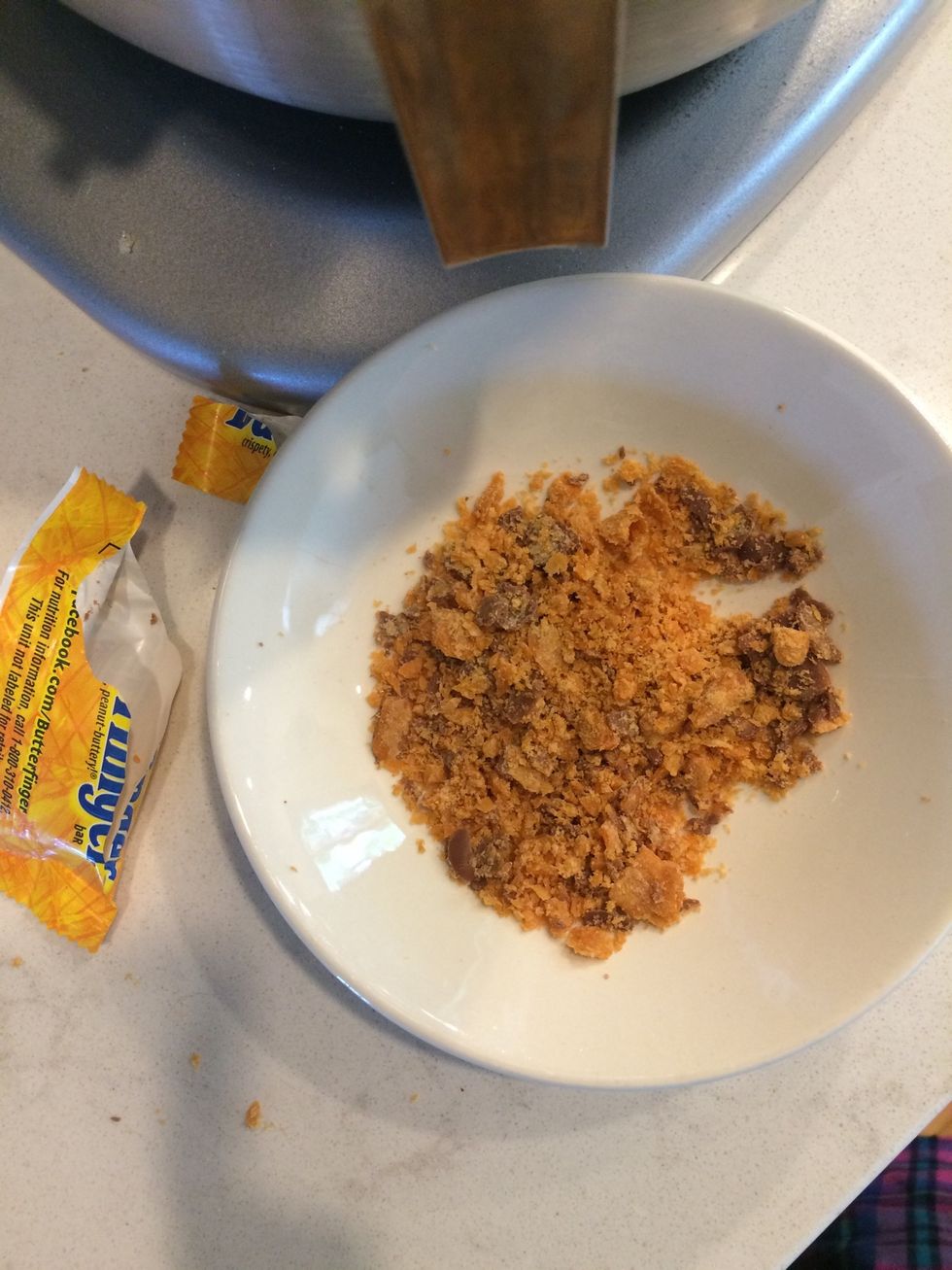 While they're baking, crunch up a Butterfinger candy bar for the topping. (This is completely optional!)