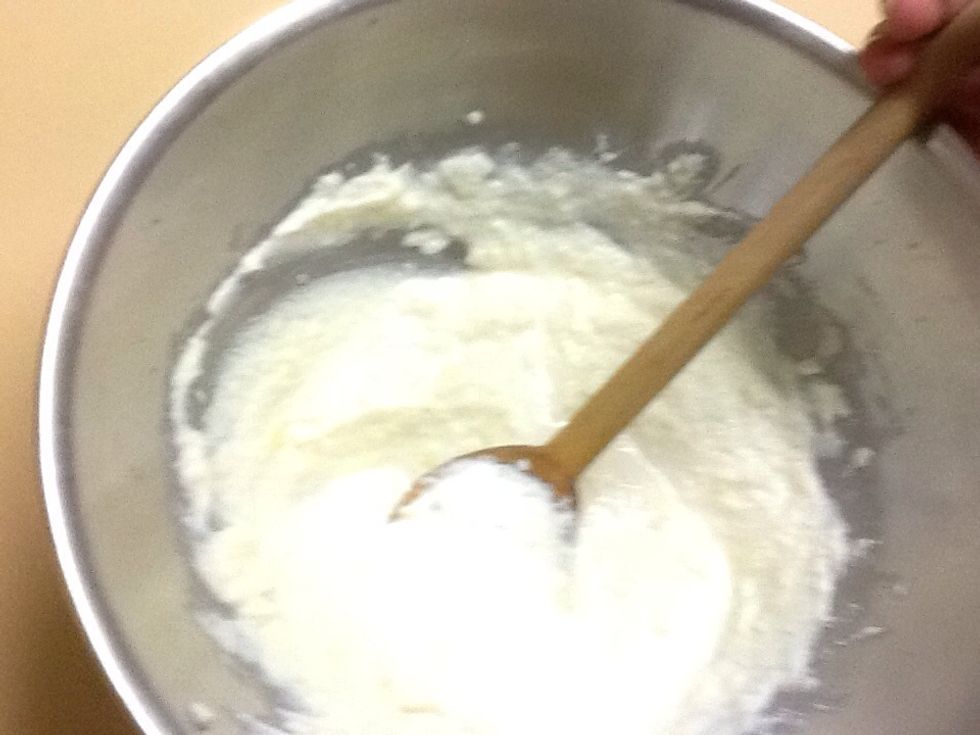 While vegetable mix is cooling in a metal bowl mix the egg white, Parmesan cheese and ricotta cheese until it is combined and has a white fluffy look