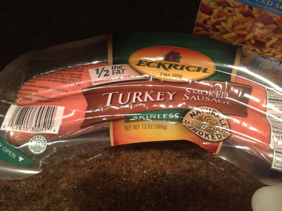 While veggies cook, cut up sausage.