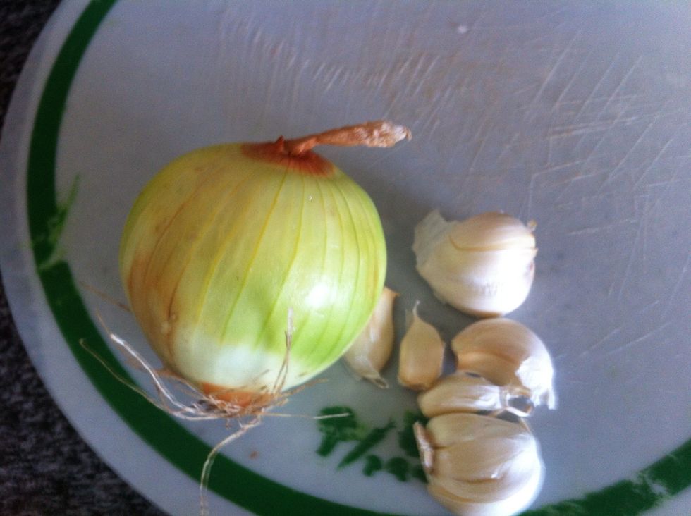 While waiting for pasta to cook, begin chopping an onion and crushing garlic. Remember, always try to use as many fresh ingredients as possible.