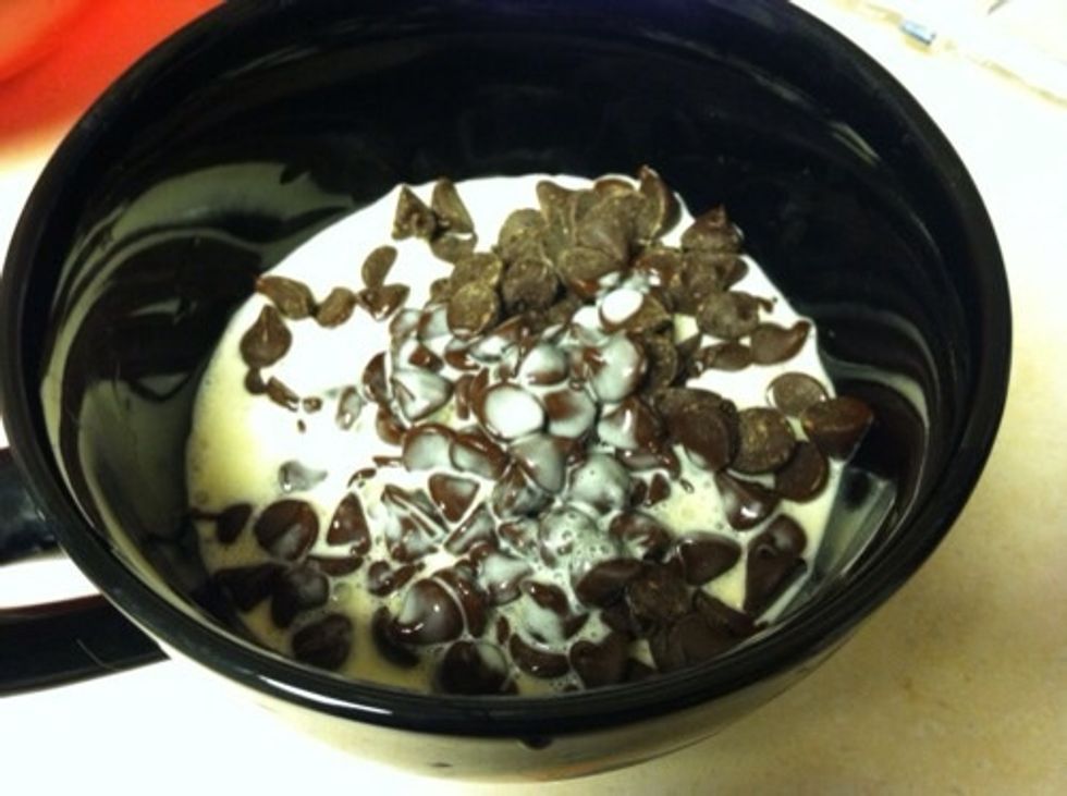 While waiting, in a small saucepan or microwave-safe container, heat heavy cream to near boiling. Pour over chocolate chips.