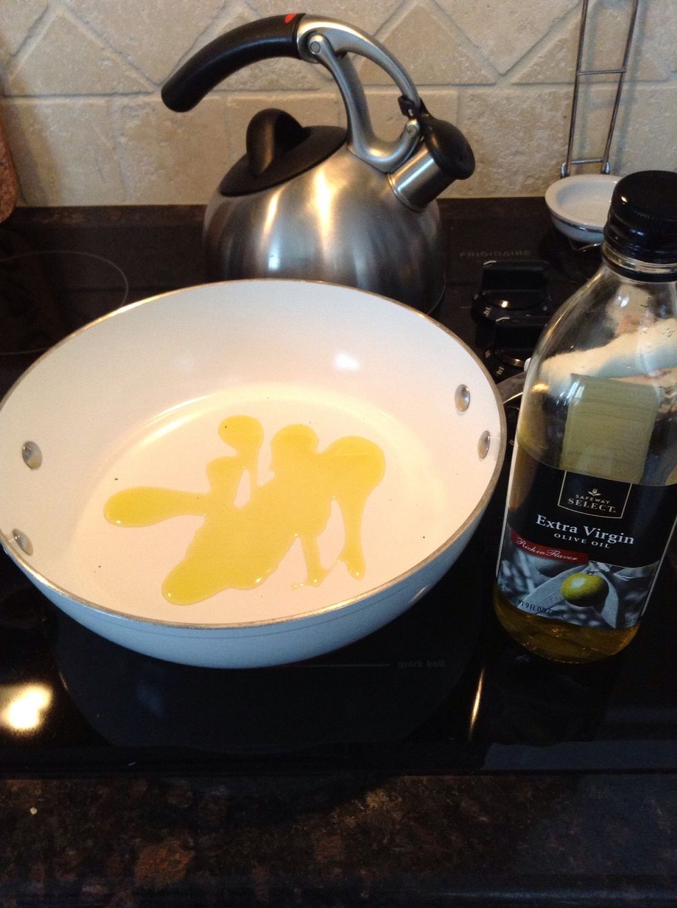While water comes to a boil- Take a large sauce pan with lid, add 2 Tbs EVOO on med-high heat.