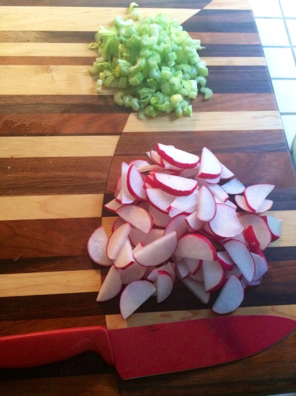 While water is heating, chop celery and radishes into 1/4 inch slices. Cut radish slices in half. If celery stalks are wide, slice in half lengthwise.