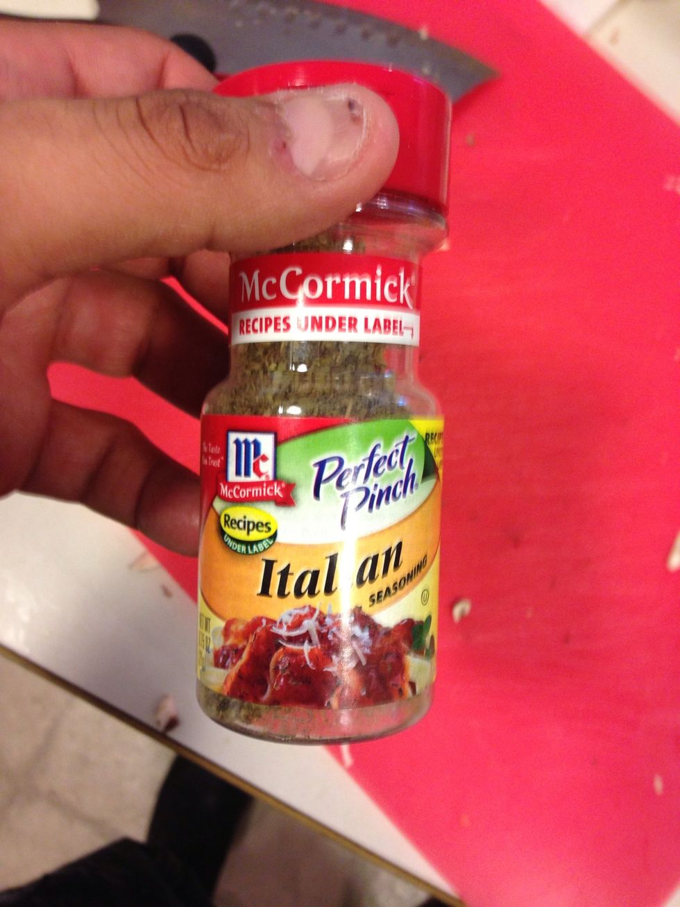 While we let that cook a bit lets get the ricotta ready. Add the ricotta, 2tsp Italian seasoning, 1 tsp garlic powder, a pinch of salt and pepper, a pinch of red pepper flakes into a bowl