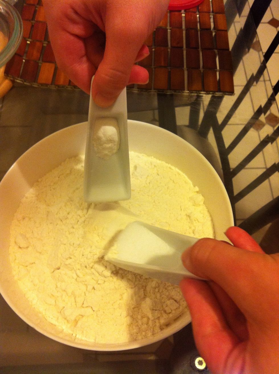 While wet ingredients are mixing, combine dry ingredients. Add salt and baking soda to flour