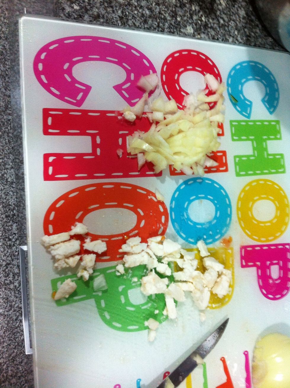 While you let the bread absorb the tomatoes chop the half onion and the cheese, (i used a local goat cheese)