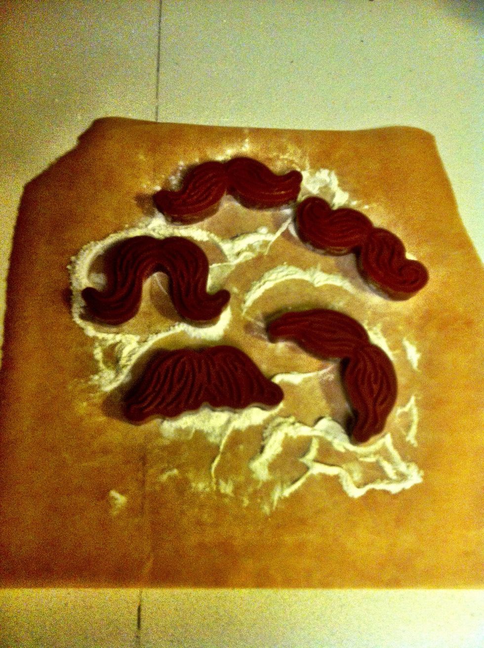 While you're waiting again, let's play with these awesome cookie cutters. To get the cleanest cookie edges, "dip" the cookie cutters in flour.