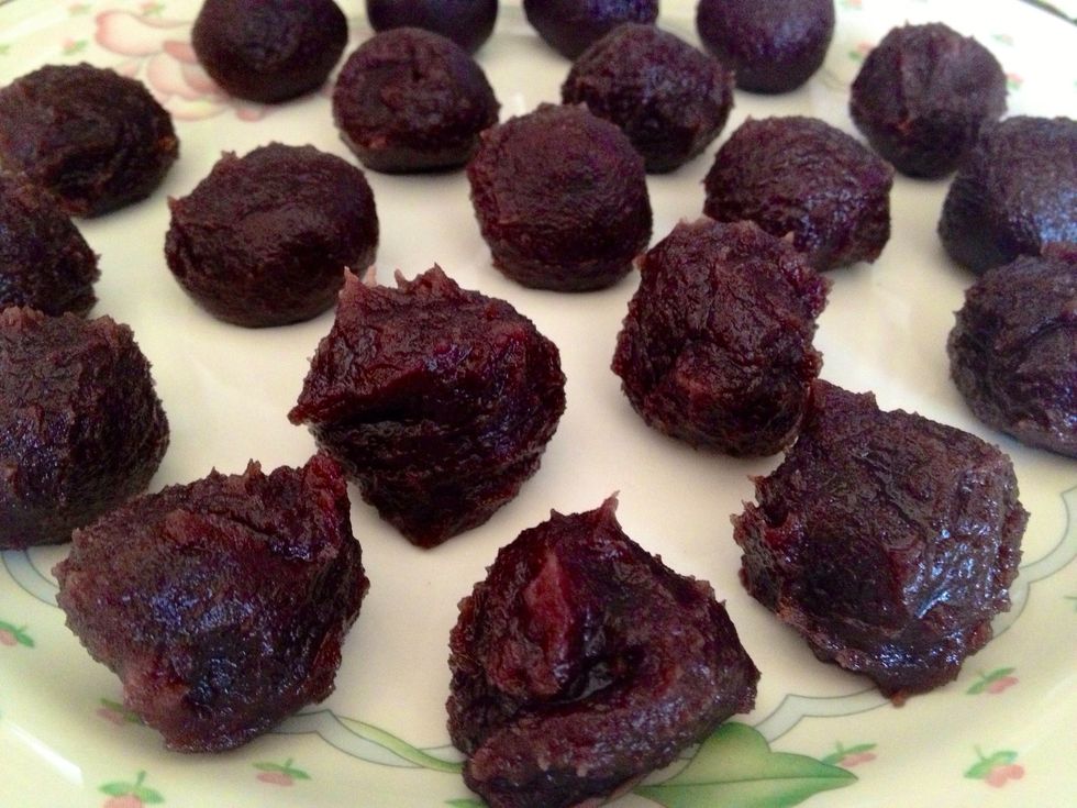 While you're waiting, get the red bean filling ready. Make round balls of red bean with the palm of your hands - roughly 1 teaspoon large.