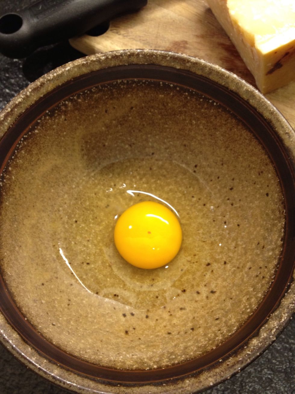 While you wait, crack the egg into a bowl. Use fresh eggs or you will meet our friend salmonella.