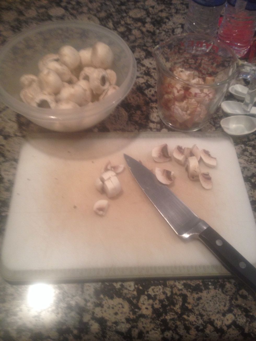 While you wait, take the stems out of the mushrooms and then cut them into bite size pieces (cut them however you like)