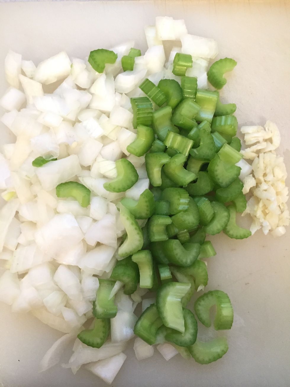 While your butter and oil is melting, roughly chop your onion, mince your garlic, and slice your celery.