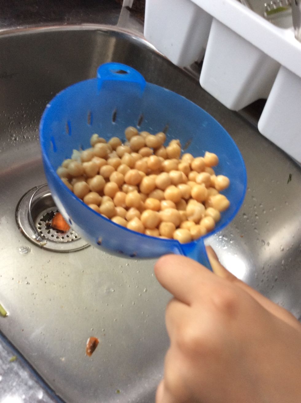 While your carrot chips are in the oven, drain your chick peas. A can of chickpeas has 255 grams of calories, 28 grams of carbohydrates, 10 grams of protein. One can of chick peas is 88 cents.