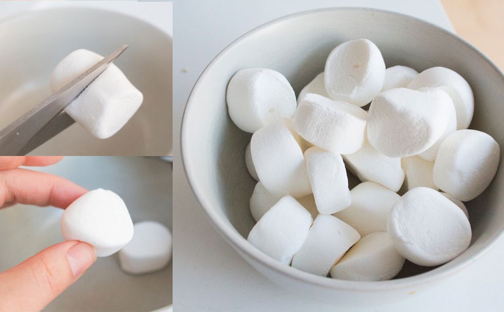 While your cookies are baking, cut your marshmallows in half.  There will be half marshmallow for each cookie.