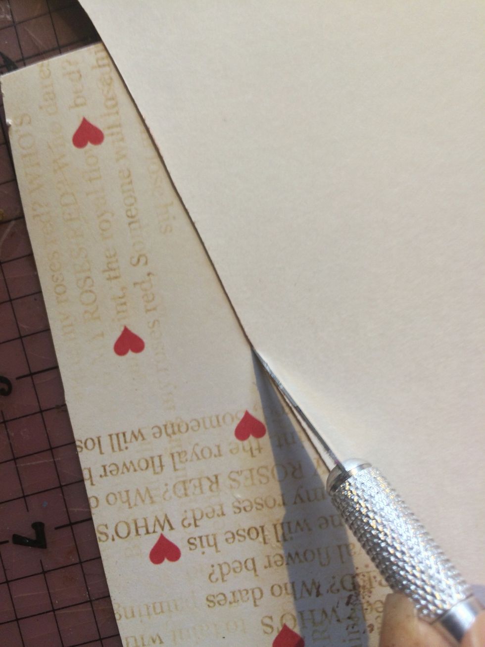 While your featehers are drying, flip your wings over. Using an exacto or craft knife, cut the away the excess paper from your wings.