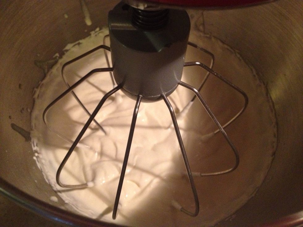 While your filling is setting, pour your thickened cream into a stand mixer with a whisk attachment, add the sugar and whip until soft peaks form.