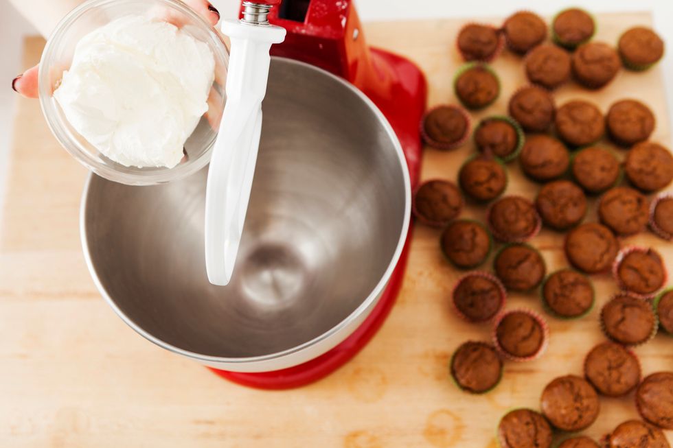While your gingerbread cupcakes cool, you can make the frosting. Add cream cheese to you mixing bowl.