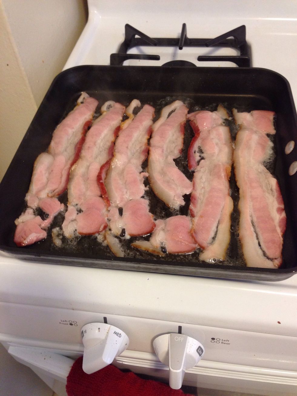 While your potatoes are cooking, start your bacon. You want it to be slightly crispy on each side.