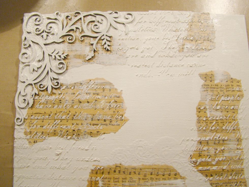 While your wings are freezing, dry brush your canvas surface and cover your chipboard corner.