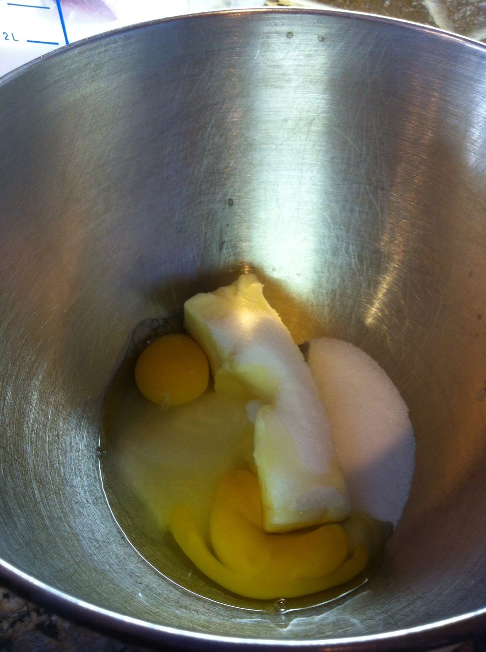 While your yeast is sitting aside, in a mixing bowl add a stick of softened butter, 2 eggs, 2 tsp vanilla and 1/2 c sugar. I have everything at room temp; just mix to blend