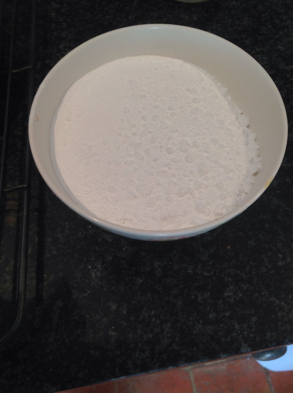 Whilst mixture is cooling, weigh out and sieve icing sugar into a separate bowl.