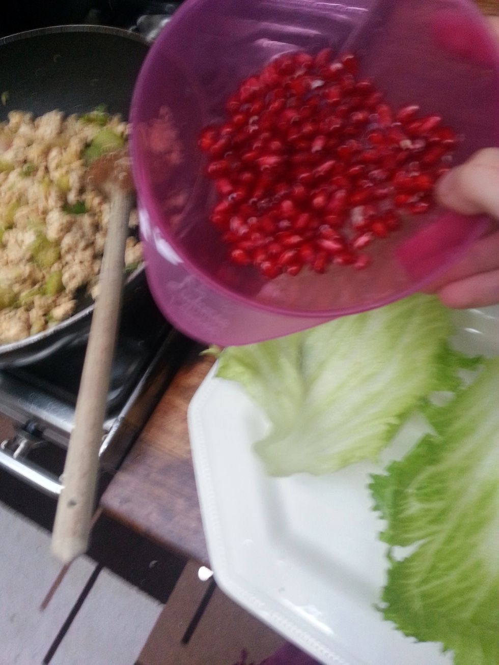 Whilst the chicken cools down after cooking, get the pomegranate ready.