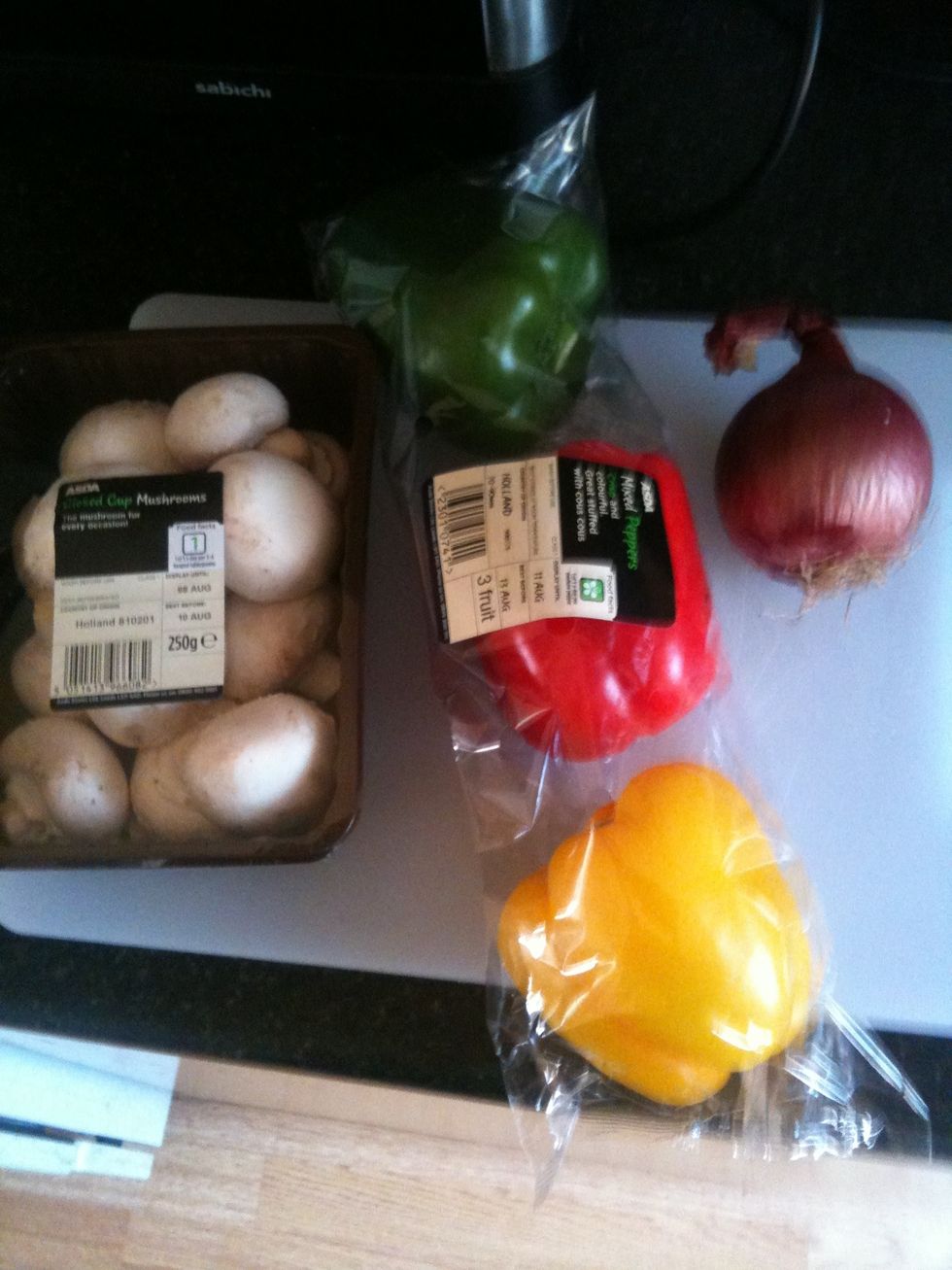 Whilst the chicken is marinating chop your mushrooms, onions and peppers (taking out all the seeds.