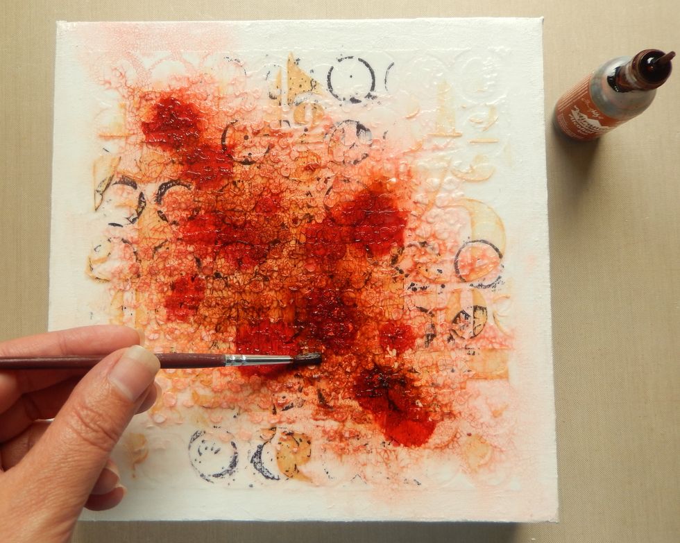 Whilst the ink is still wet add Rust Alcohol ink between the existing drips with a brush and blend. Mist with more water if required. Repeat the process using Latte and Mountain Rose Alcohol Inks.